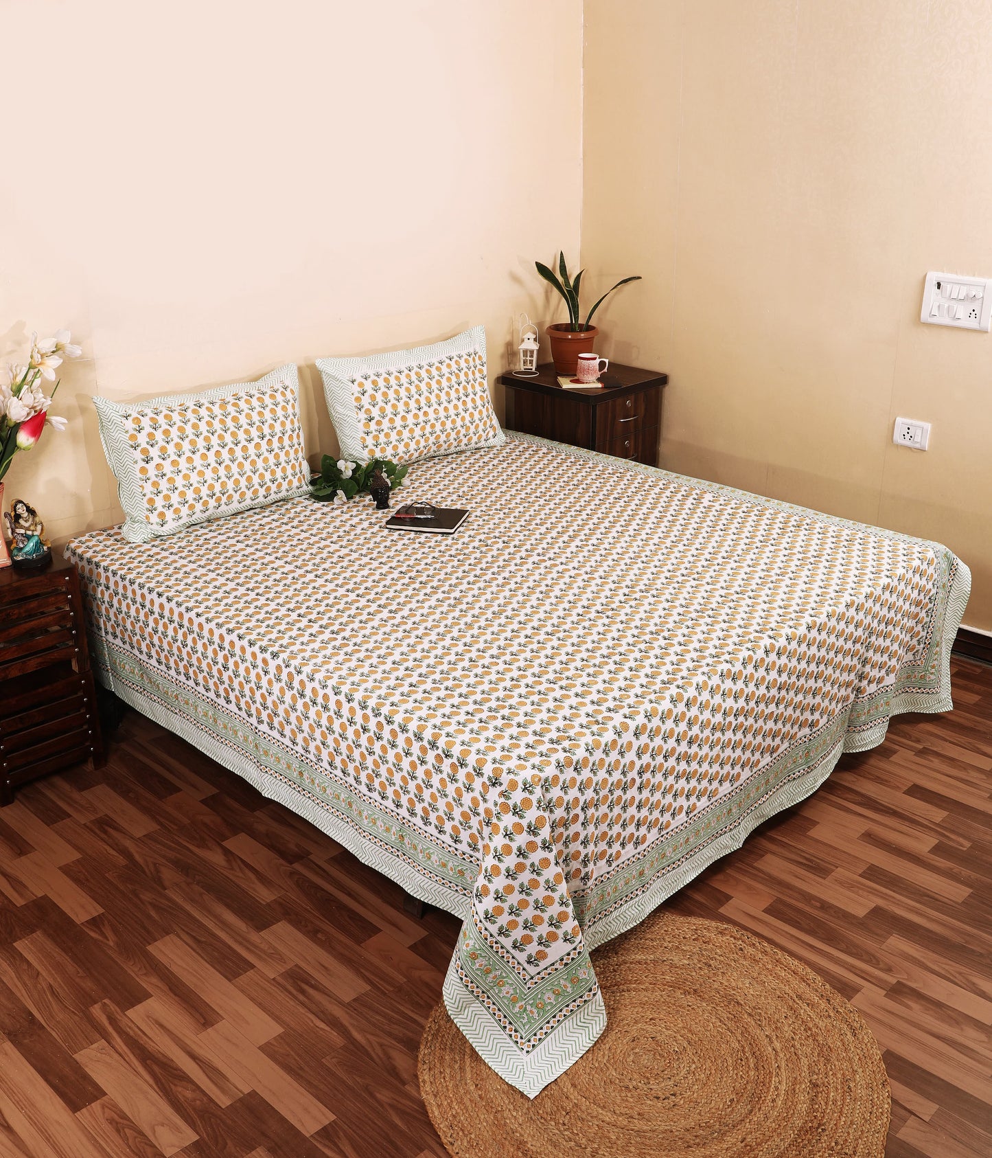 Highmour Bloomline collection bed linens, block print bedsheet in soothing colors on a wooden bed