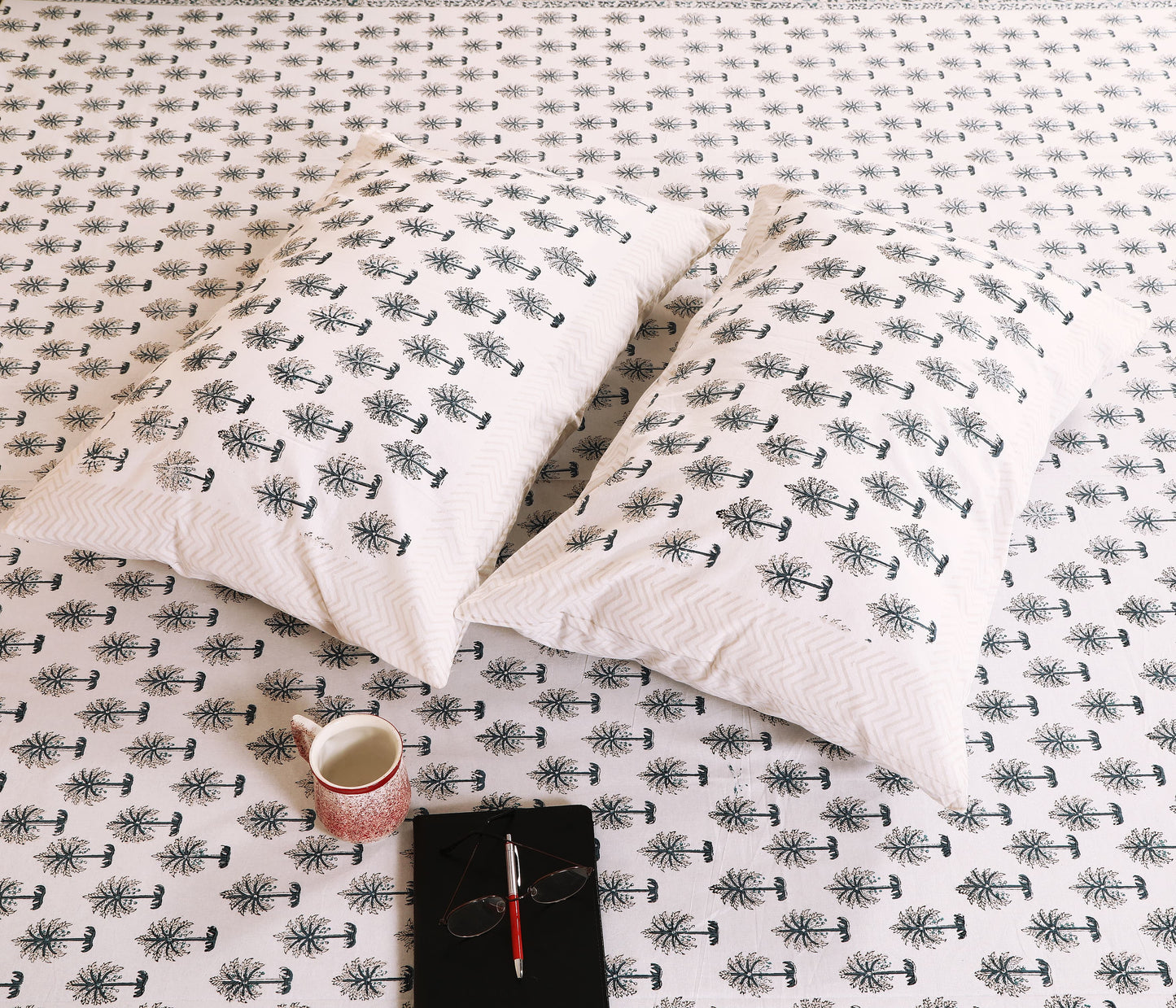 Highmour palm tree print fabric bedsheet with matching pillows for a tropical bedroom style