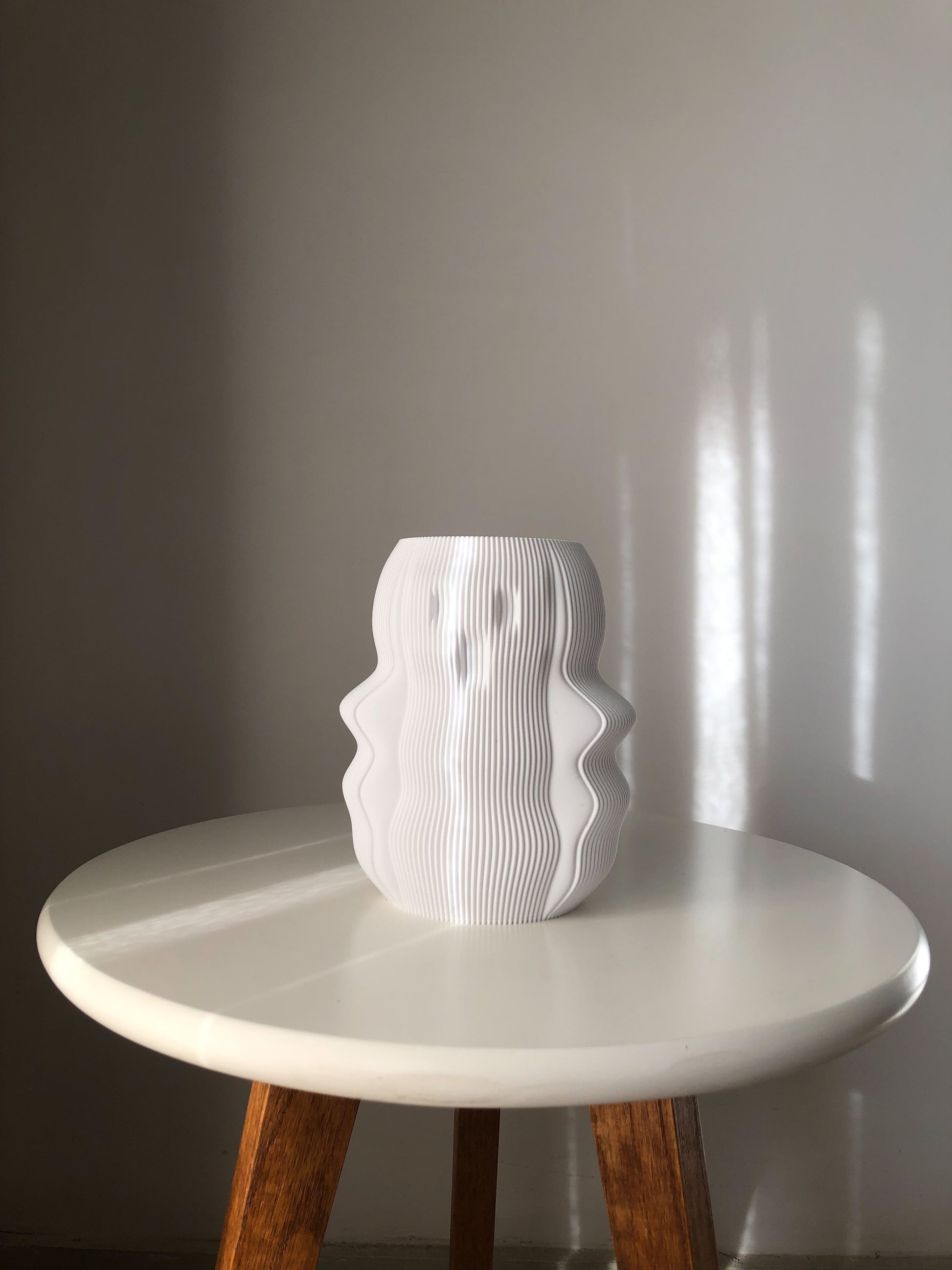 My Store unique white vase with an artistic wavy design displayed on a white table