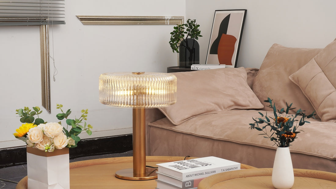 A modern lamp on a coffee table with flowers.
