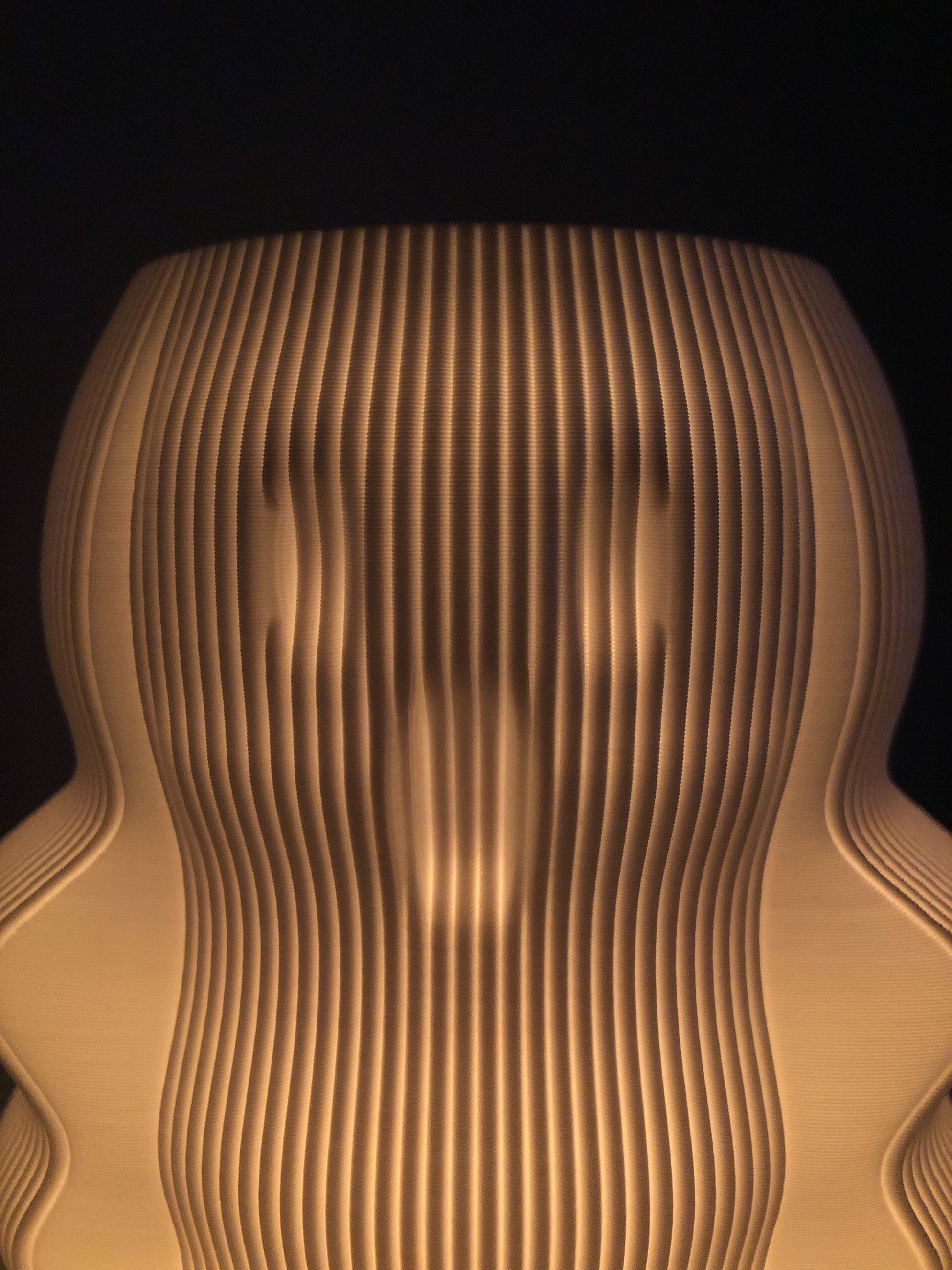 Unique modern decorative lamp with a textured design creating warm ambient light