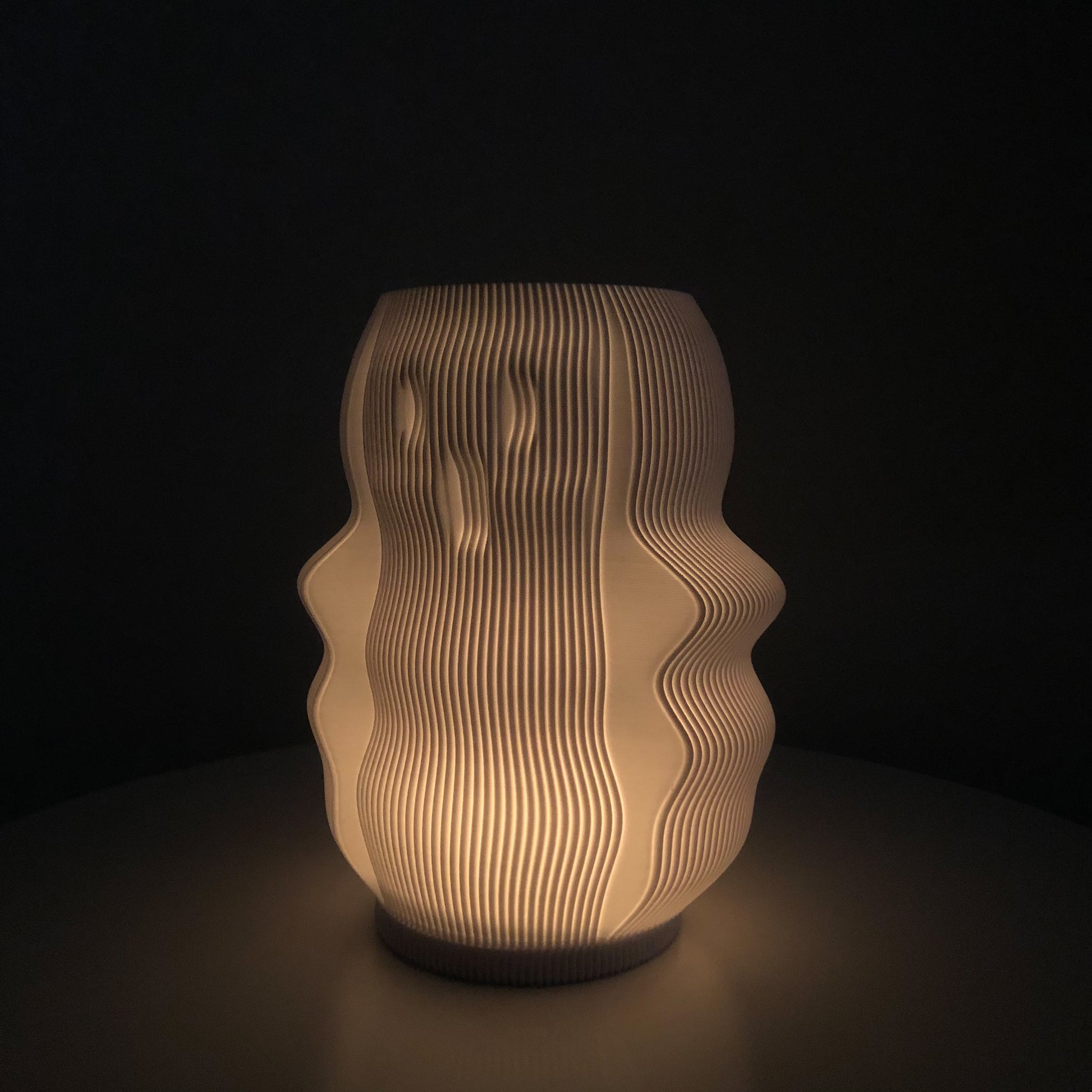 Unique modern decorative lamp with curved design and soft glow, perfect for contemporary home decor