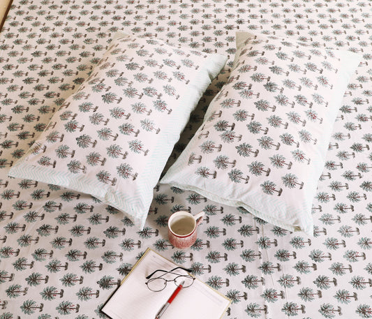 Highmour bedsheet featuring palm tree print fabric with matching pillow covers on a light background