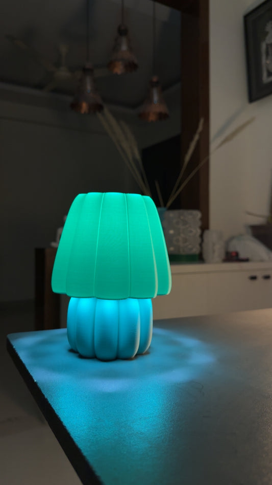 Stylish soft glow night lamp with a teal shade, perfect for creating a calming ambiance