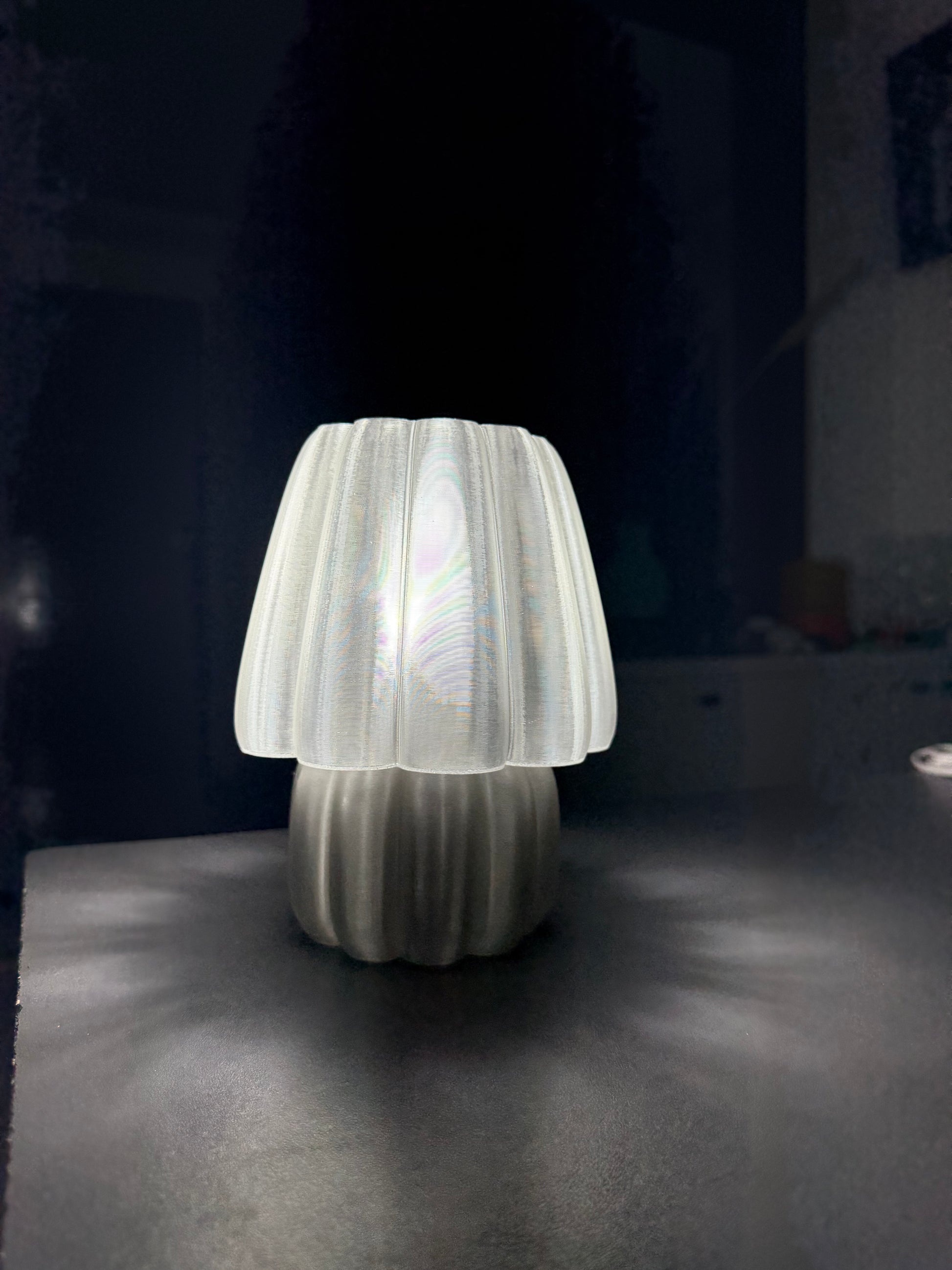 Soft glow night lamp with a unique white design illuminating a dark room for cozy ambiance