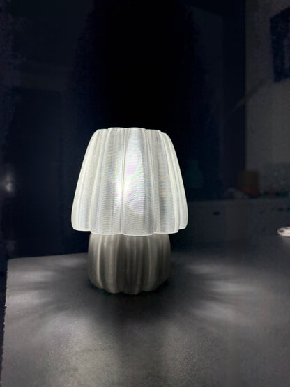 Soft glow night lamp with a unique white design illuminating a dark room for cozy ambiance