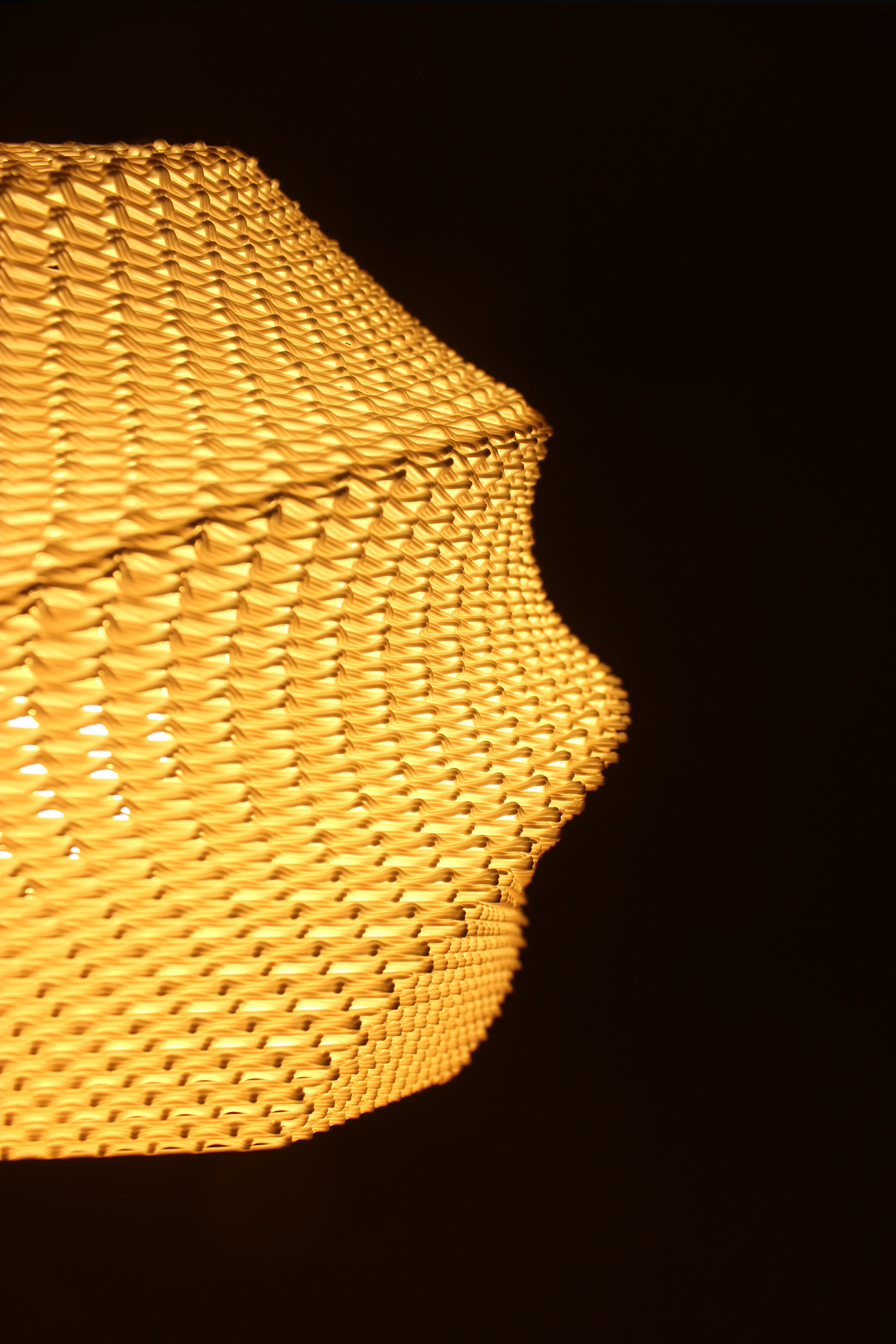Highmour textured ceiling light cover in an intricate woven design emitting warm light