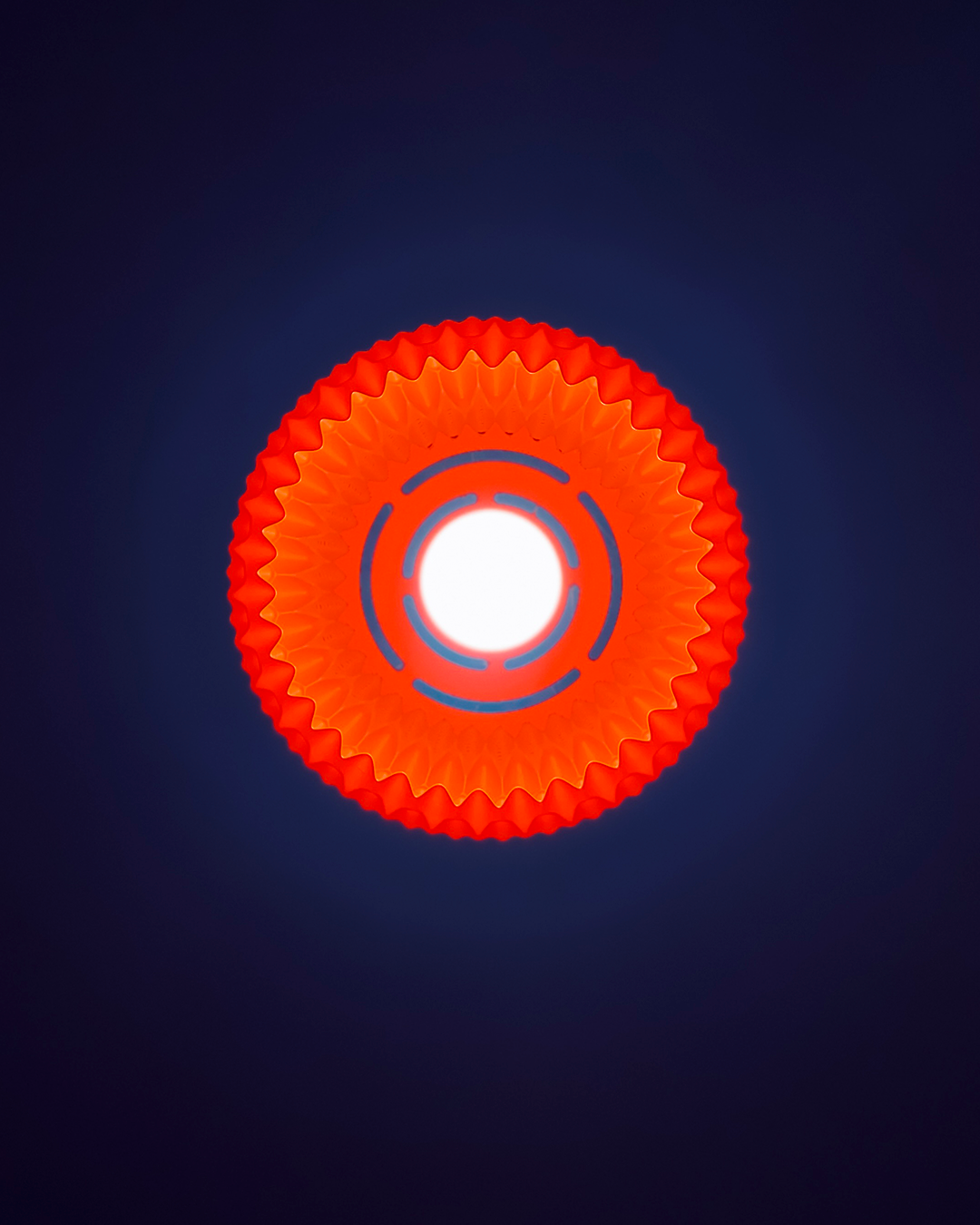 Unique pendant lighting in vibrant red with a textured circular design for modern home decor