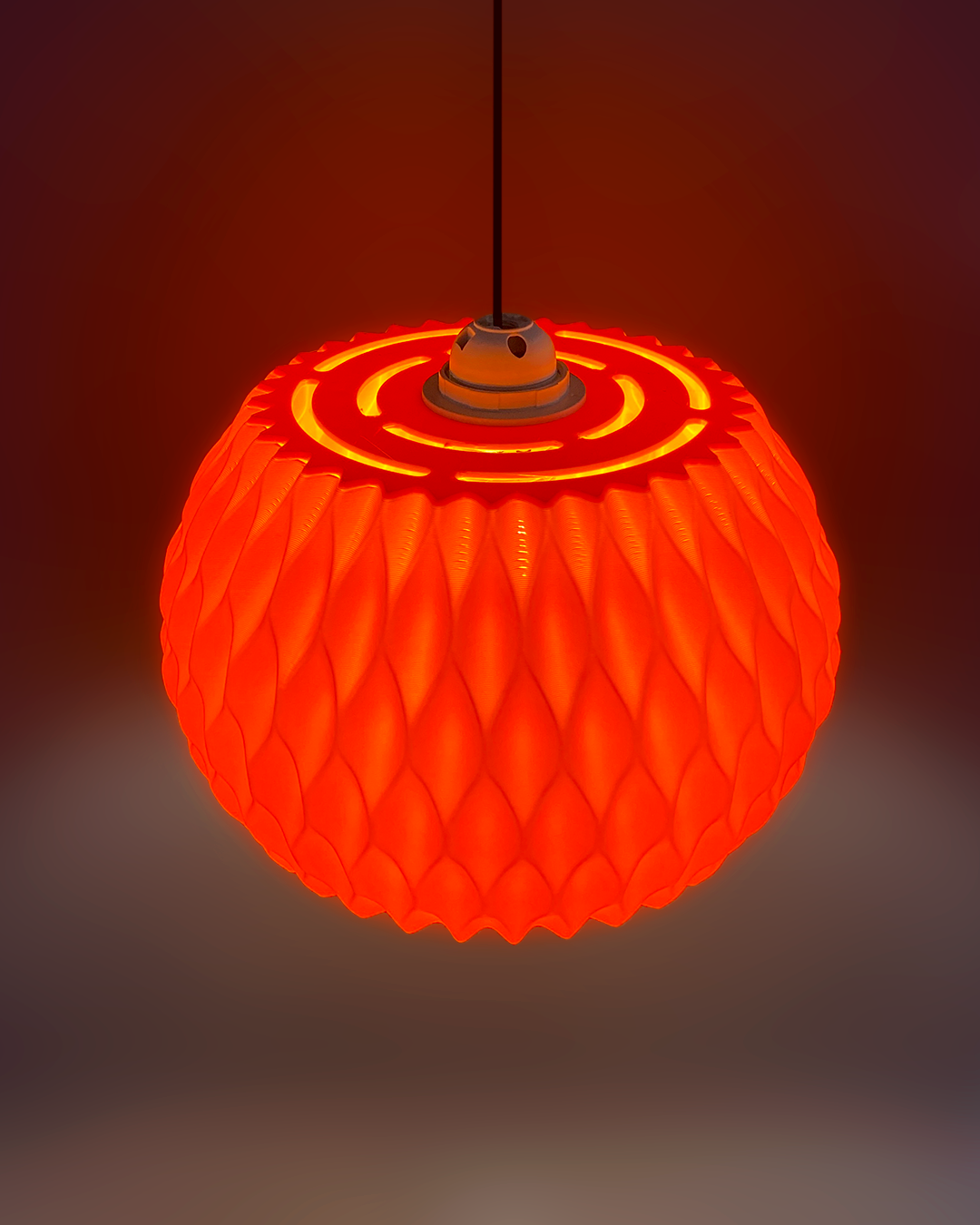 Highmour unique pendant lighting in an eye-catching orange design with textured surface and circular pattern