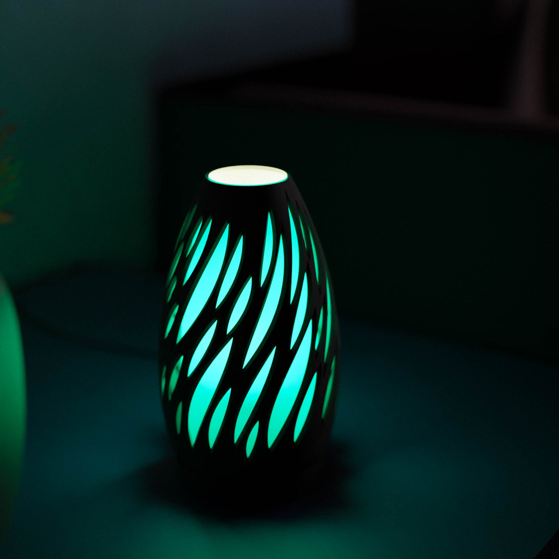 Highmour unique silhouette lamp with a modern design that emits a soothing blue glow