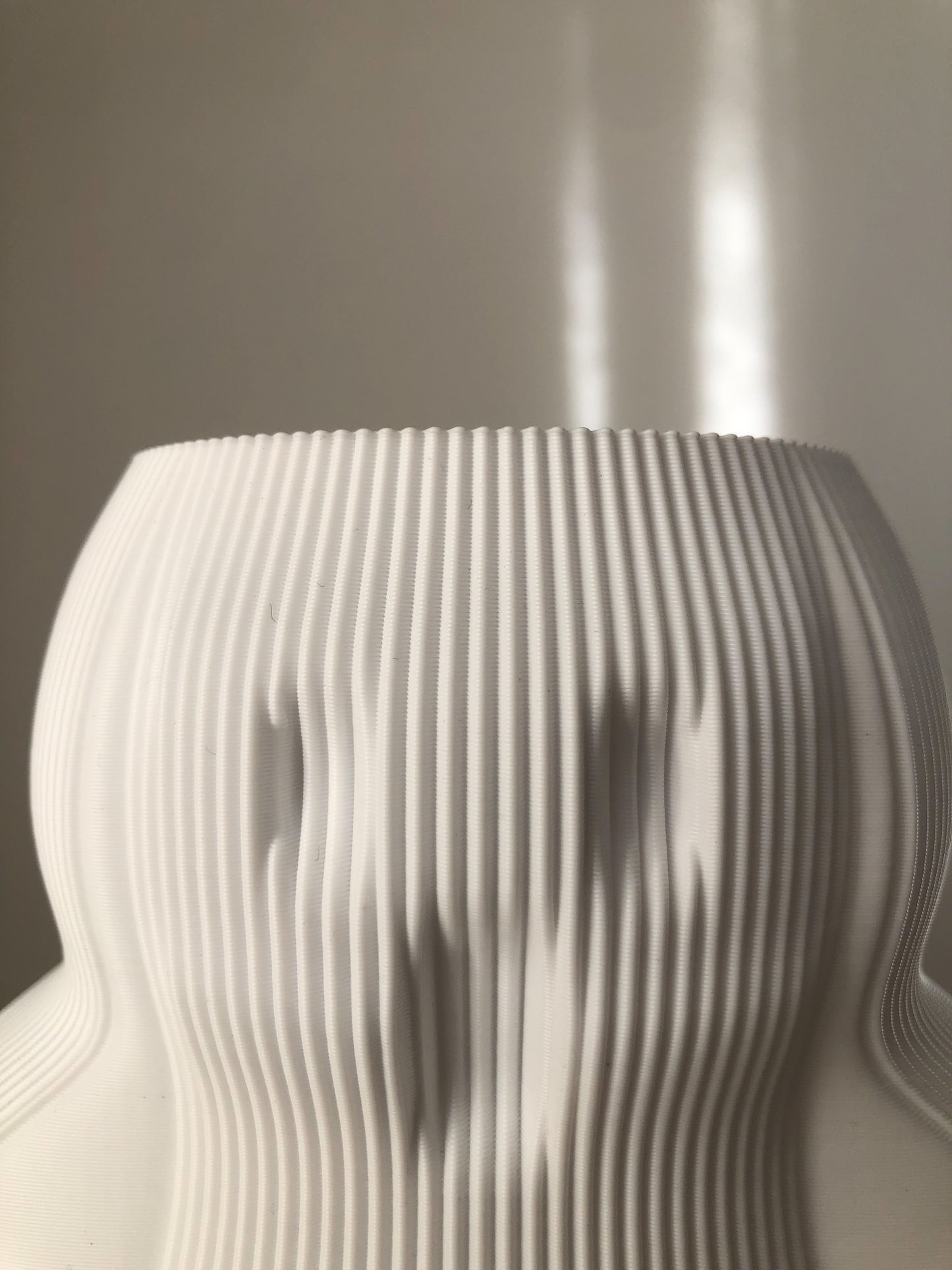 Unique white vase with textured design, perfect for modern home decor